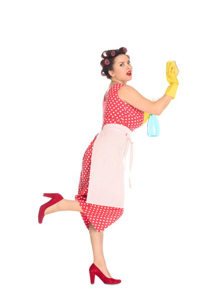 emotional plus size woman in rubber gloves with cleaning supplies wiping blank space isolated on white - Zdjęcie, obraz