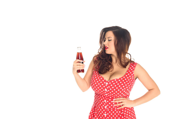 attractive plus size woman with bottle of soda isolated on white - Foto, imagen
