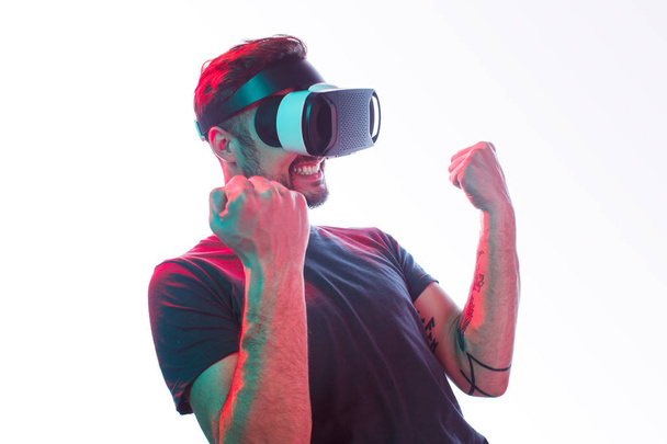 Successful man gaming in VR glasses - Photo, image