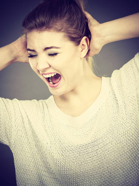 Unhappy woman screaming and yelling in pain. Bad, negative human face expressions, gestures concept. - Foto, imagen