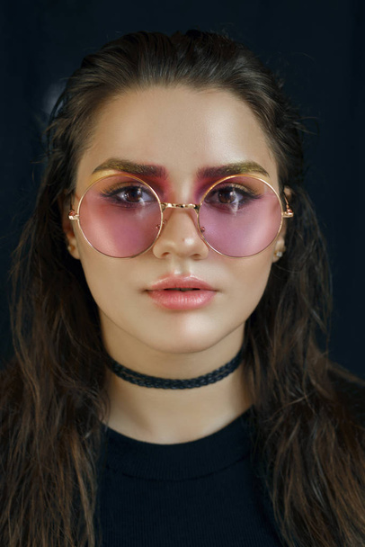 girl in pink glasses - Фото, изображение