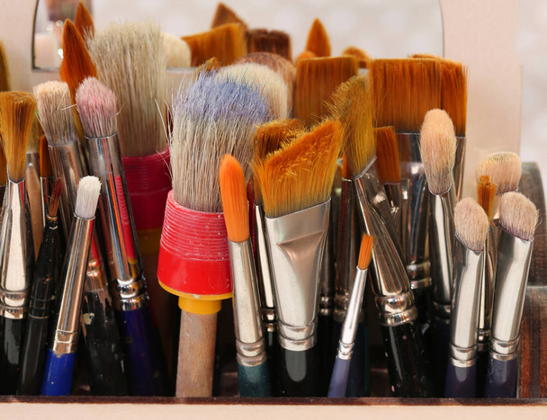 brushes of various colors and dimensions of a painter - 写真・画像