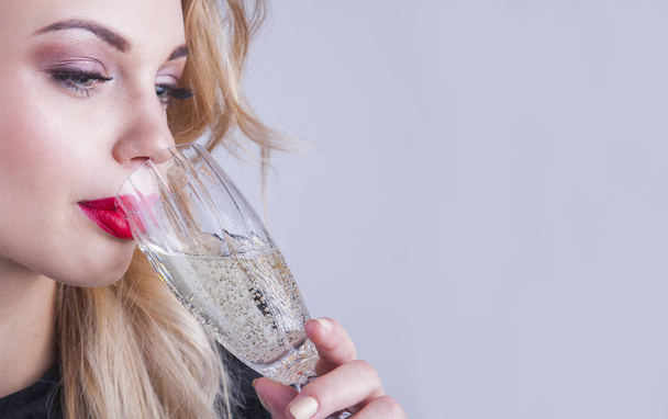 Elegant woman drinking a champagne. Celebrate. - Foto, Imagem
