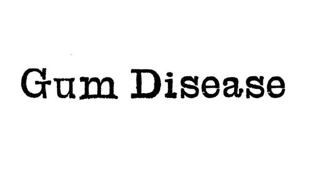 Sanat Gum Disease kirjoituskoneesta valkoisella taustalla
 - Valokuva, kuva