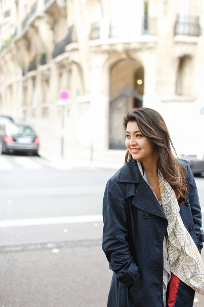 Asian female student going in street background, walking after classes. - Valokuva, kuva