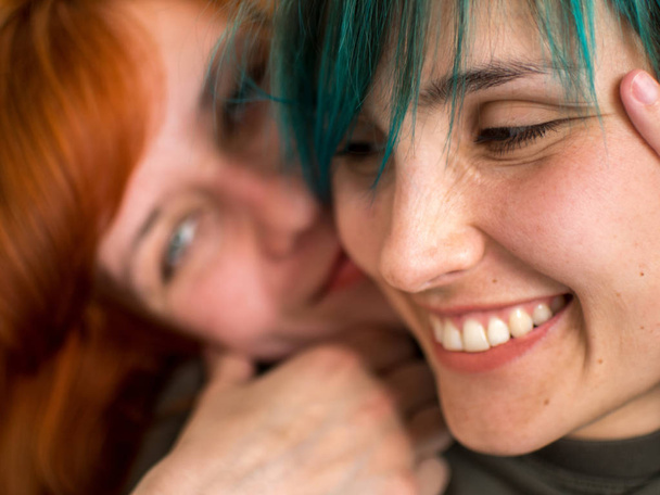 Portrait of two pretty lesbian girlfriends kissing and have fun - Fotoğraf, Görsel