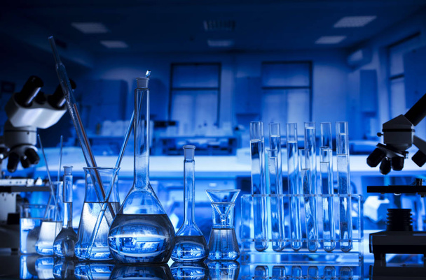Laboratory interior. Laboratory equipment  glass beakers and microscope. Science concept. - Photo, Image