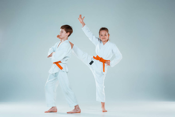 The boy fighting at Aikido training in martial arts school. Healthy lifestyle and sports concept - Foto, imagen