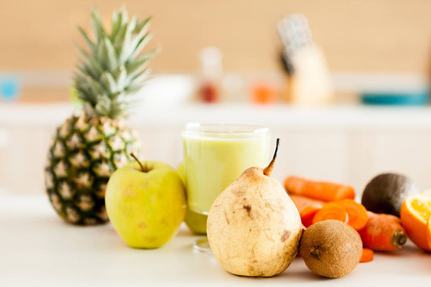 Detox juice next to fruits and vegetables - Φωτογραφία, εικόνα