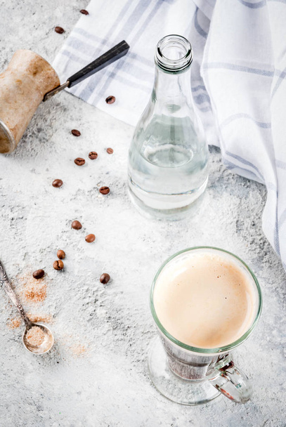Trendy modern drink. Coffee espresso with mineral water, with coffee maker and roasted beans, Gray stone background, copy space top view - Photo, Image