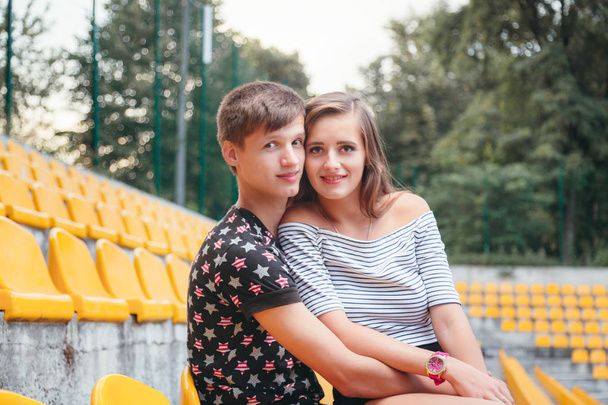 Young loving couple at the stadium - Φωτογραφία, εικόνα