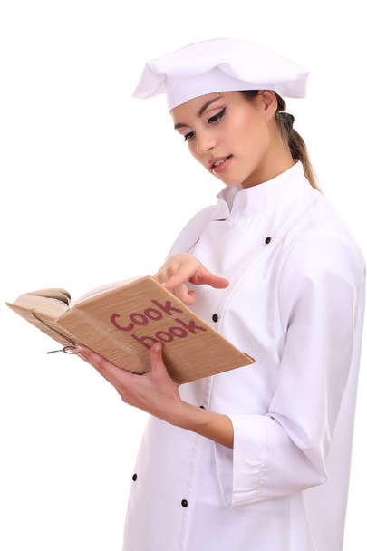Portrait of young woman chef with cook book isolated on white - Фото, зображення