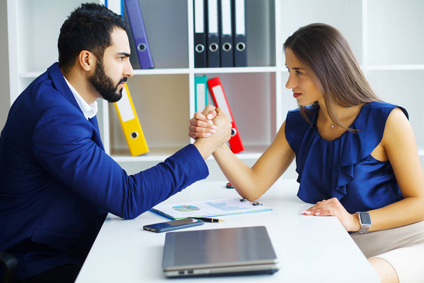 Business people woman and man arm wrestling - Photo, Image