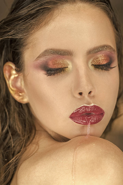 Young cute woman with pink lipstick and water drops on her lips - Foto, Imagem