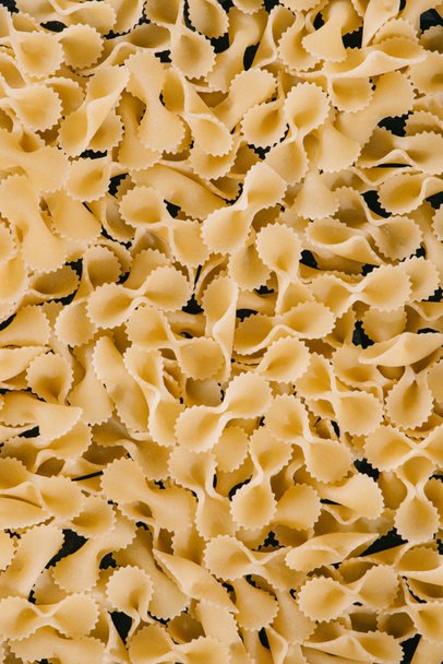 full frame of pile of uncooked pasta - Fotoğraf, Görsel