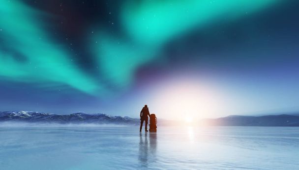 Silhouette of adventurous man standing on frozen lake with backpack, looking at northern lights. - Photo, Image