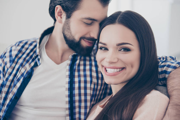 Closeup cropped portrait of cheerful positive couple bearded man enjoying smell parfume of his smiling charming lover. True feelings affection idyllic harmony concept - Photo, image