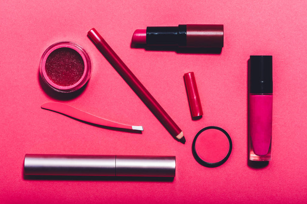 Beauty tools laying on vivid pink background. - Photo, Image