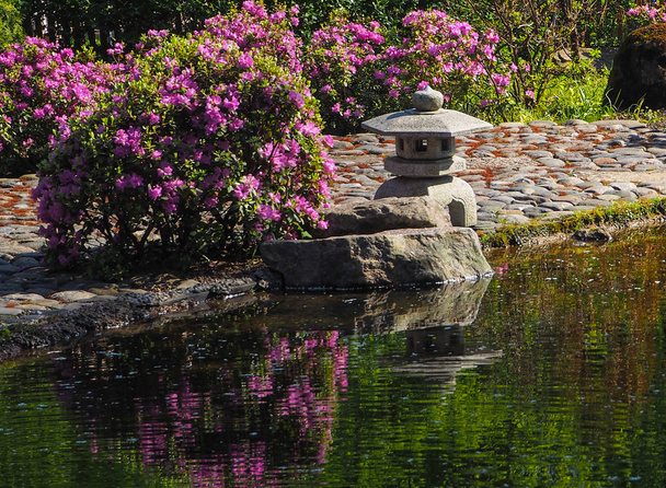 Stone lantern in a Japanese garden.  - Zdjęcie, obraz