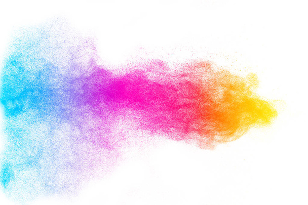 Multi color powder explosion on white background. Launched colorful dust particles splashing. - Photo, Image
