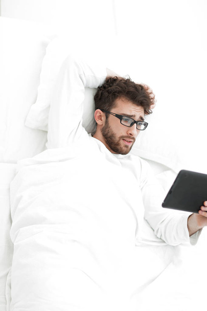 background image . modern man reading on digital tablet. - Zdjęcie, obraz
