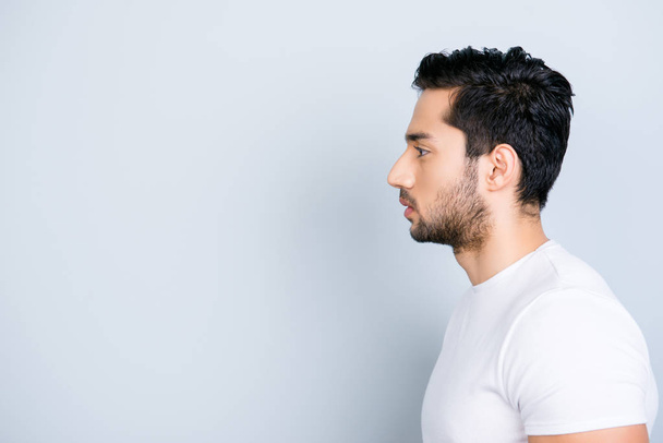 Profile side view portrait with copy space empty place for product of virile harsh macho in white outfit isolated on grey background wellness wellbeing daily care grooming concept - Photo, image