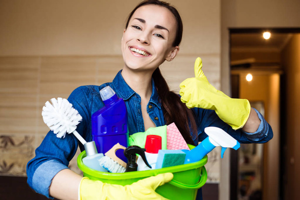 Woman With the Equipment and Supplies for Cleaning at House in Hands - Foto, Imagem