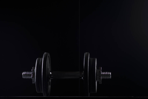 Bodybuilding weights concept on black background. High resolution image concept for bodybuiding or fitness industry. - Fotó, kép