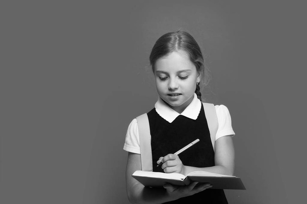 Pupil writes in book with marker. Back to school concept - Photo, image