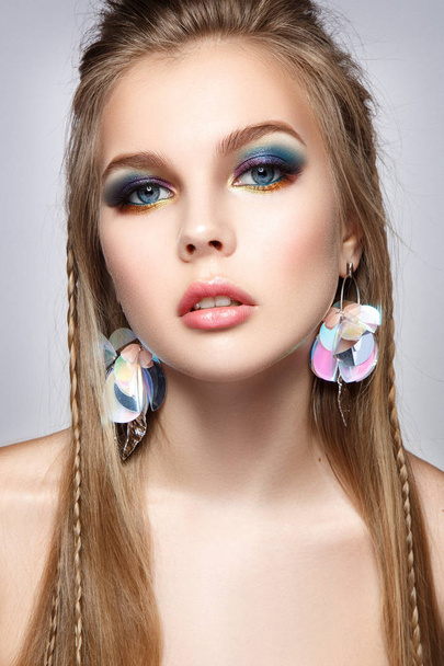 Beautiful woman portrait with colorful make up and bright earrings. - Fotografie, Obrázek