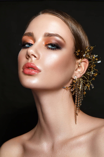 Beautiful woman portrait profile with jewelry on ear. - Foto, Imagem
