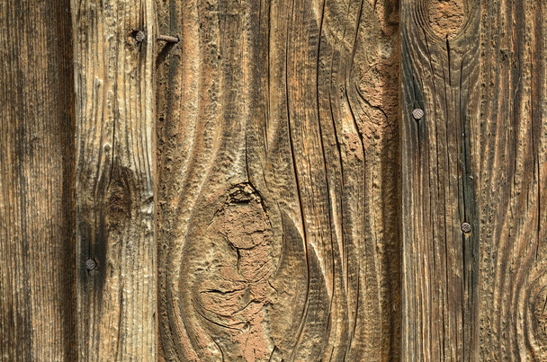 An old wooden board is light brown with no paint, texture. Background, wallpaper - Φωτογραφία, εικόνα