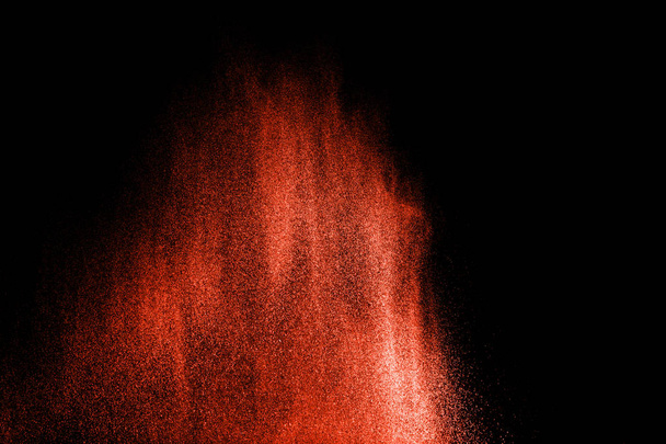 Bizarre forms of powder painted and flour combined explode in front of a black background to give off fantastic colors and forms. - Фото, изображение