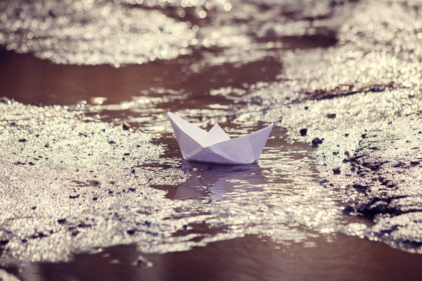 A paper boat swims along the spring streams - Photo, Image