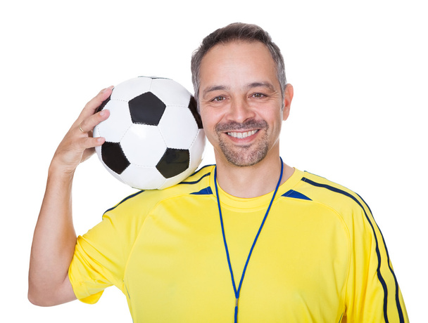 Portrait Of A Happy Man Holding A Soccer Ball - Foto, afbeelding