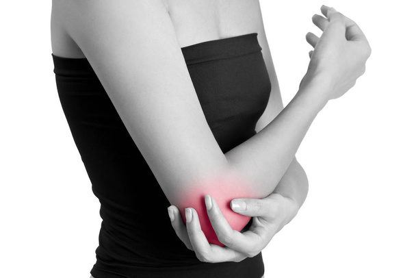 woman holding her elbow with red highlighted on pain area , black and white colur isolate on white background. - Foto, immagini