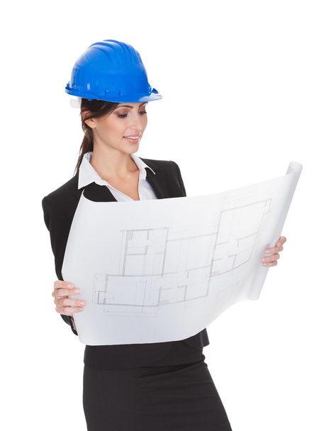 Female Architect Holding Blueprints - Foto, imagen