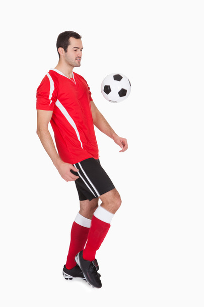 Professional soccer player kicking ball - Foto, Imagem