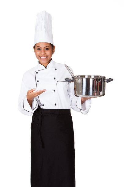 Female Chef With Cooking Pot In Hand - Foto, immagini