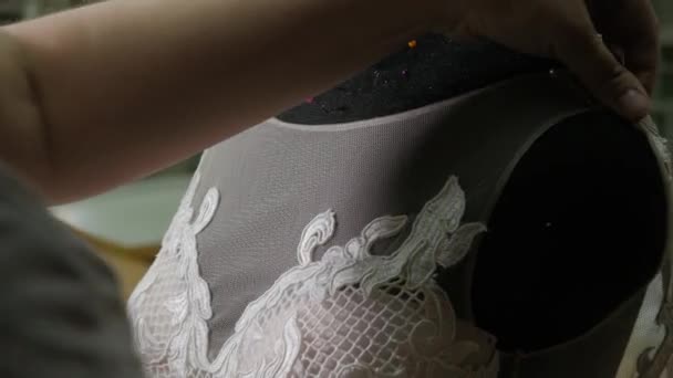 close-up of needle and thread, embroider pattern. Equipment for sewing elegant wedding dress. Hand made - Footage, Video