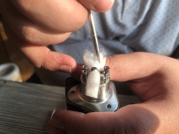 setting Vape coil and  wicking cotton - Photo, Image