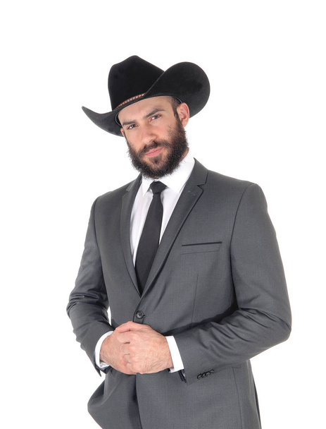 A close up portrait image of a handsome man in a suit and cowboy ha - Foto, Imagen