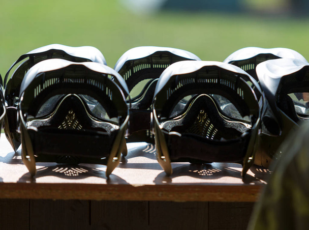 special protective masks for paintball lay on the table - Foto, Imagem