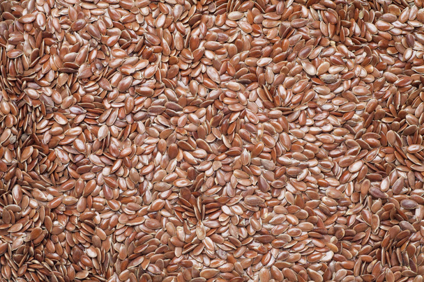 Brown flax seeds textuur achtergrond, Food concept. - Foto, afbeelding