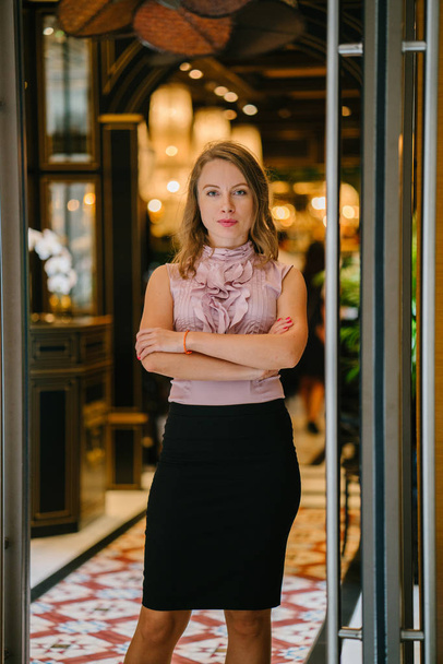portrait of a young, tall, attractive blond Caucasian woman. She is dressed in professional office attire and posing  - Foto, Imagem