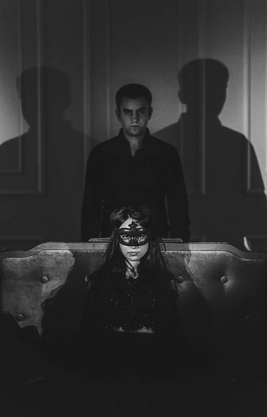 Caucasian couple and shadows on dark bedroom - Foto, Imagem