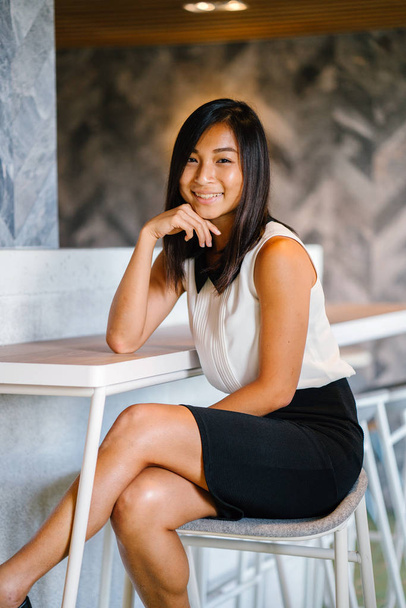 Portrait of a beautiful asian businesswoman in  casual clothes. Asian business woman in cafe - Photo, Image