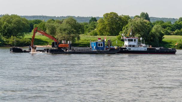 Ship with excavator deepening the bottom of the river. - Photo, Image