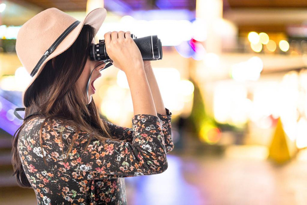 Surprised woman with binoculars  - Foto, Imagen