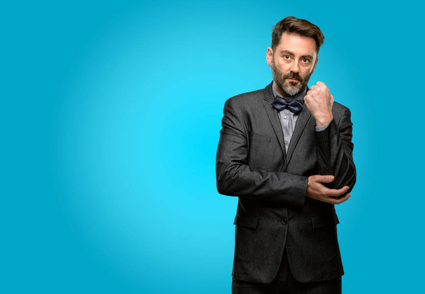 Middle age man, with beard and bow tie with crossed arms confident and serious - Photo, Image